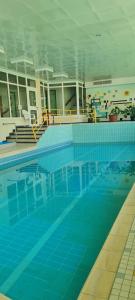 a large swimming pool in a large building at Ferienappartement in Black Forest in Baiersbronn