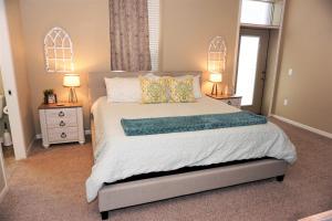 a bedroom with a large bed with two night stands at Cozy 3br Downtown Bakery & Shops! in La Crosse