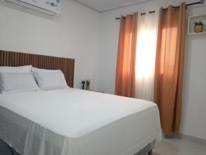 Ένα ή περισσότερα κρεβάτια σε δωμάτιο στο Suite Amaris LC
