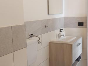 a bathroom with a sink and a mirror at A casa di Adua in Cupello