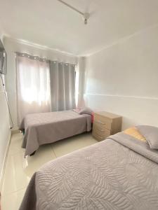 Ένα ή περισσότερα κρεβάτια σε δωμάτιο στο Hostal la Plaza