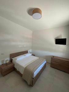 Giường trong phòng chung tại I Borghetti