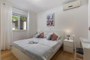 Ένα ή περισσότερα κρεβάτια σε δωμάτιο στο Holiday Home Asteria - Happy Rentals