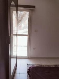 Postel nebo postele na pokoji v ubytování Apartment in villa magawish