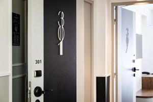 a door with a sign on it next to a room at Best Western Premier The Blake Paris Gare Saint Lazare in Paris