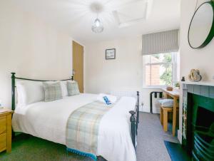 Voodi või voodid majutusasutuse Four Priory Road, Chichester toas