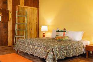 Ένα ή περισσότερα κρεβάτια σε δωμάτιο στο Mawamba Lodge