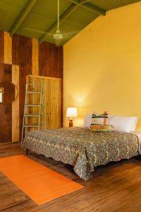 Ένα ή περισσότερα κρεβάτια σε δωμάτιο στο Mawamba Lodge