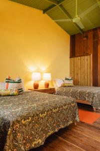 Ένα ή περισσότερα κρεβάτια σε δωμάτιο στο Mawamba Lodge