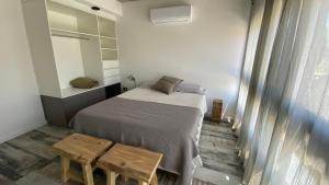 Ένα ή περισσότερα κρεβάτια σε δωμάτιο στο Moderno depto frente al río!