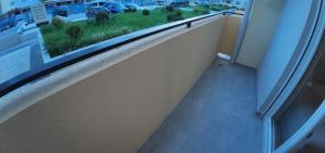a window sill in a room with a view of a street at Apartments Eagle, close to center Podgorica, free parking, available transport in Podgorica +3 photos