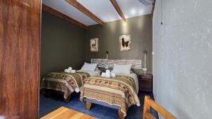 Ένα ή περισσότερα κρεβάτια σε δωμάτιο στο Hostal Pablito