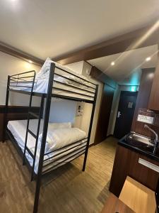a bunk bed room with two bunk beds in it at Gold Coast Hotel Incheon in Incheon