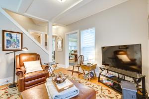 a living room with a couch and a flat screen tv at Prime Lakeside Village Location Apt with Kitchen! in Bemus Point