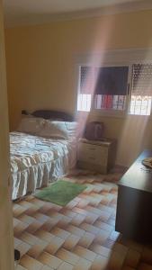 Letto o letti in una camera di Une belle maison avec jardin au centre Moulay bousselham