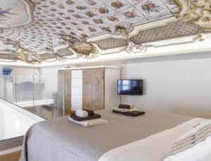 TV a/nebo společenská místnost v ubytování CASA LE 4 ARTI - 86Mq in Via Lagrange 43 LUXURY