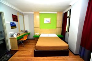 Classic Boutique Hotel Kuantan客房内的一张或多张床位
