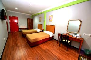 Classic Boutique Hotel Kuantan客房内的一张或多张床位