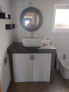 a bathroom with a sink and a mirror at Casa da Tia Avelina in Angra do Heroísmo +20 photos