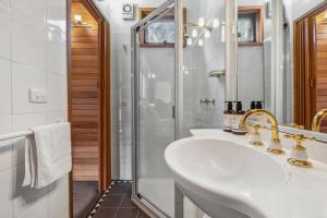 a bathroom with a sink and a shower at Nowhere Chalet in Crackenback +48 photos