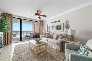 a living room with a couch and a ceiling fan at Bluewater Unit 404 in Orange Beach
