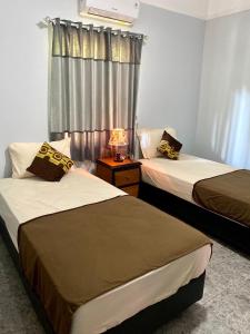 Postel nebo postele na pokoji v ubytování The Coral Lodge