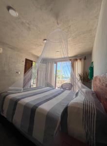 Postel nebo postele na pokoji v ubytování Casa Ik en Coba