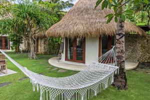 Κήπος έξω από το Acacia Bungalows Bingin