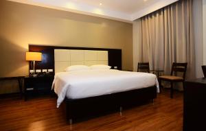 Postel nebo postele na pokoji v ubytování Ever O Business Hotel + 7 fotografií