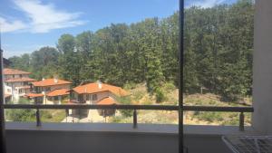 a view from a window of houses with trees at Art Studio Sea in Shkorpilovtsi