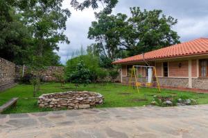 a house with a yard with a playground at La Pradera, Casa de Campo Privada, 2-14 Personas - Cambio Oficial in Tarija