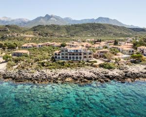 an aerial view of a resort on a beach at Hotel Liakoto in Kardamili