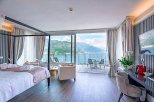 a bedroom with a bed and a view of the ocean at Borgo Le Terrazze in Bellagio