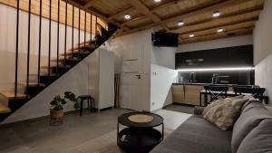 a living room with a couch and a kitchen at Szwedzki Zakątek in Szwecja