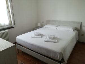 Postel nebo postele na pokoji v ubytování Appartamento Quattro