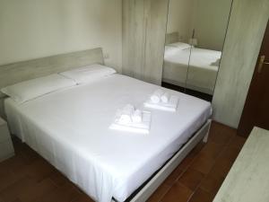 Postel nebo postele na pokoji v ubytování Appartamento Quattro