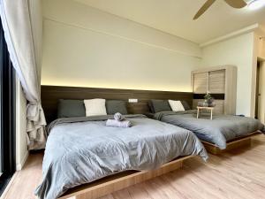 Ένα ή περισσότερα κρεβάτια σε δωμάτιο στο Muji Style 1-6 pax 2Q bed Shah Alam near MSU Sec13