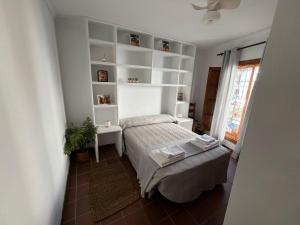 En eller flere senge i et værelse på Casa Lucero