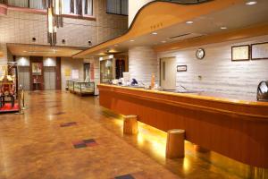 a large lobby with a bar in a hospital at Hill Hotel Sunpia Iga in Iga