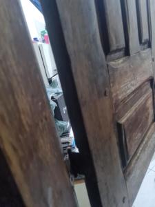 a close up of a wooden door in a room at Delta confot hostel in São Luís