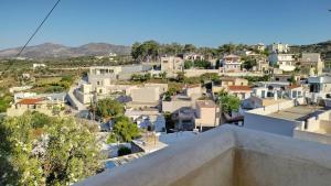 a view of a city from the roof of a house at Malvazia Residence in Kamilari