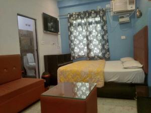 Postel nebo postele na pokoji v ubytování Hotel O Home Fauzi Rasoi & Guest Homestay