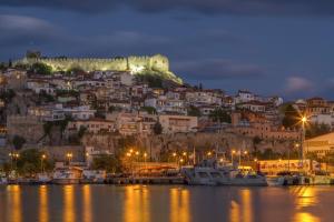 a town on a hill with boats in the water at 2 Doors- Luxury by the sea, easy parking in Kavála