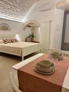 Postel nebo postele na pokoji v ubytování Frida, suite in stile pugliese