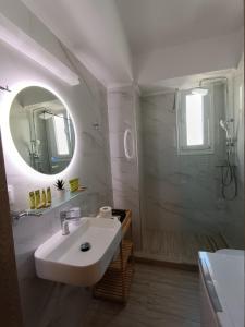 a white bathroom with a sink and a mirror at Dimitra#RelaxHomeKallithea in Kallithea Halkidikis +78 photos
