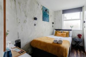 Postelja oz. postelje v sobi nastanitve ND Hotel