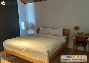Katil atau katil-katil dalam bilik di 壹貳貳洋樓 l 自助入住 l 無人櫃檯