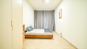 Postel nebo postele na pokoji v ubytování Vinhomes quận 9