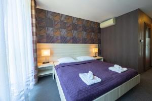 Postel nebo postele na pokoji v ubytování Baltic Inn