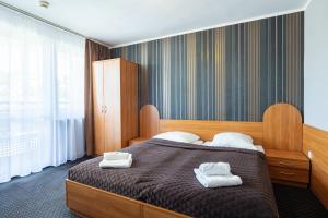 Postel nebo postele na pokoji v ubytování Baltic Inn